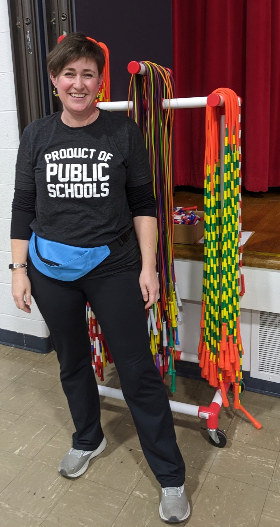 Photo of volunteer in Product of Public Schools t-shirt